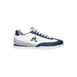 Tenisówki Le Coq Sportif Model Veloce Kolor Biały. Niebieskie obuwie sportowe damskie le coq sportif, bez wzorów, ze skóry, bez zapięcia. Za 308.80 zł.