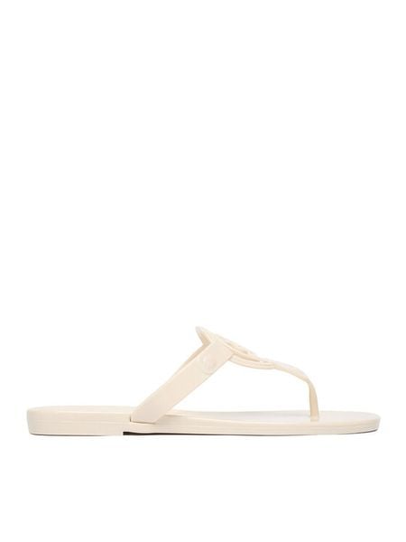 Nine West Japonki CEO-CT0906-1 Écru. Białe klapki damskie Nine West, bez wzorów, z syntetyku, bez obcasa, bez zapięcia. Za 79.99 zł.
