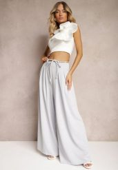 Jasnoniebieskie Szerokie Spodnie High Waist Zapinane na Suwak z Wiązaniem w Talii Vikonnia. Niebieskie spodnie materiałowe damskie Renee, bez wzorów, z jeansu. Za 54.99 zł.
