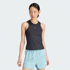 Koszulka All Gym Seasonal Rib Tight Fit Tonal 3-Stripes Tank. Niebieskie koszulki damskie Adidas, xs, bez wzorów, z dzianiny, bez kołnierzyka, bez ramiączek. Za 199.00 zł.