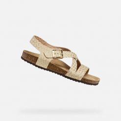 Sandały GEOX D BRIONIA Złoty. Żółte sandały damskie Geox, bez wzorów, ze skóry, bez obcasa, bez zapięcia. Za 351.99 zł.