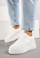 Białe Sneakersy na Grubej Podeszwie z Tłoczeniami Zdobione Przeszyciami Falinia. Białe obuwie sportowe damskie Born2be, z jeansu, bez zapięcia. Za 99.99 zł.