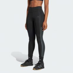 Długie legginsy Optimé 3-Stripes. Czarne legginsy damskie Adidas, l, bez wzorów. W wyprzedaży za 235.80 zł.