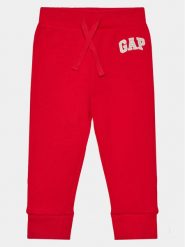 Gap Spodnie dresowe 633913-02 Czerwony Regular Fit. Czerwone spodnie dresowe chłopięce GAP, z bawełny. Za 99.99 zł.