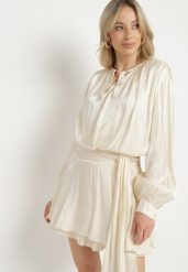 Beżowa Wiskozowa Sukienka Ozdobiona Wiązaniem i Falbanką Rallio. Brązowe sukienki damskie Born2be, z aplikacjami, z jeansu, eleganckie, bez ramiączek. W wyprzedaży za 127.49 zł.