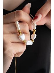 Heliophilia Naszyjnik z perłami syntetycznymi rozmiar: onesize. Żółte naszyjniki damskie Heliophilia, z perłą, z mosiądzu. Za 26.99 zł.