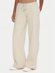 Guess Jeans Spodnie dresowe W5BB04 KC811 Beżowy Wide Leg. Brązowe spodnie dresowe damskie Guess Jeans, xs, z aplikacjami, z bawełny. Za 349.99 zł.