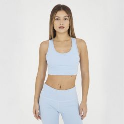 Crop top sportowy treningowy FEBE. Niebieskie biustonosze sportowe damskie LEGEA, bez wzorów, z materiału. W wyprzedaży za 84.50 zł.