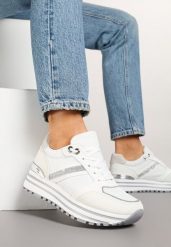 Białe Sneakersy na Grubej Podeszwie Zdobione Brokatem Elenina. Białe obuwie sportowe damskie Born2be, z jeansu, bez zapięcia. Za 79.99 zł.
