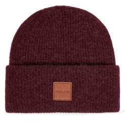 Czapka Coach. Fioletowe czapki damskie Coach, na zimę, bez wzorów. Za 409.99 zł.
