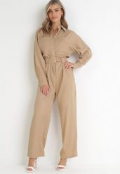 Beżowy Kombinezon z Paskiem Phynne. Brązowe sukienki damskie Born2be, bez wzorów, z materiału, eleganckie, bez ramiączek. W wyprzedaży za 246.49 zł.