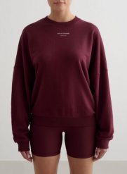 Damska bluza frotte, luźna, z okrągłym dekoltem Apparel Terry wiśniowa. Czerwone bluzy damskie Aim'n, xs, bez wzorów, z dzianiny, bez kaptura. Za 177.60 zł.
