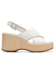 Clarks Skórzane sandały "Manon Wish" w kolorze białym na koturnie rozmiar: 42. Białe sandały damskie Clarks, bez wzorów, z otwartym noskiem, bez obcasa, na koturnie, bez zapięcia. Za 241.56 zł.