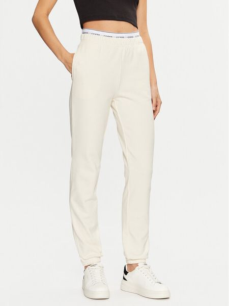 Guess Spodnie dresowe O5RB01 KCO31 Écru Regular Fit. Spodnie dresowe damskie Guess, xl, z aplikacjami, z bawełny. Za 149.99 zł.