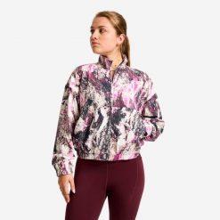 Bluza sportowa damska Domyos. Fioletowe bluzy damskie DOMYOS, l, bez wzorów, z materiału, bez kaptura. Za 99.99 zł.
