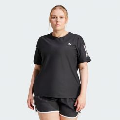 Koszulka Own The Run (Plus Size). Czarne bluzki damskie Adidas, m, bez wzorów, z materiału, bez kołnierzyka, bez ramiączek. Za 159.00 zł.