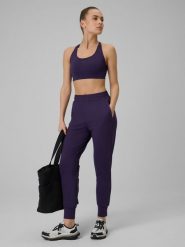 4F Spodnie treningowe szybkoschnące damskie - fioletowe M. Fioletowe spodnie materiałowe damskie 4F, bez wzorów. Za 179.99 zł.