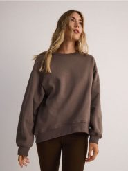 Bluza oversize - brązowy. Brązowe bluzy damskie Reserved, l, bez wzorów, z bawełny, bez kaptura. W wyprzedaży za 49.99 zł.