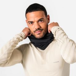 Komin do biegania Kiprun Warm+ ocieplany. Czarne kominy damskie KIPRUN, bez wzorów, z materiału. Za 44.99 zł.