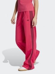 Adidas Spodnie dresowe w kolorze różowym rozmiar: M. Różowe spodnie dresowe damskie Adidas, m, bez wzorów, z dresówki. Za 209.95 zł.