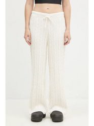 Adidas Spodnie dresowe "KNTD Jogger" w kolorze kremowym rozmiar: S. Brązowe spodnie dresowe damskie Adidas, s, bez wzorów, z dresówki. Za 191.07 zł.