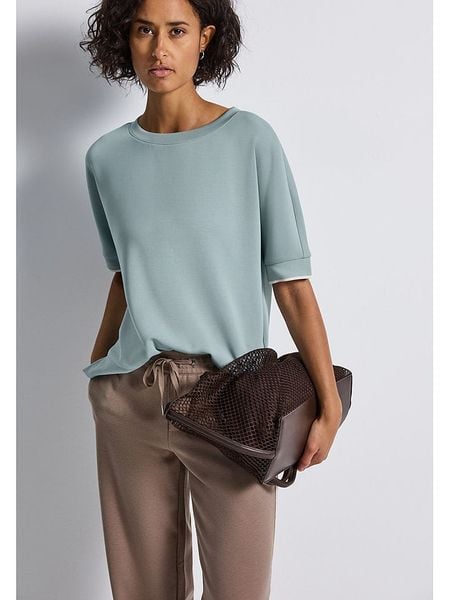 Street One Koszulka w kolorze błękitnym rozmiar: 38. Niebieskie koszulki damskie Street One, bez wzorów, bez kołnierzyka, bez ramiączek. Za 118.84 zł.