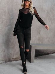 Milan Kiss Bluzka w kolorze czarnym rozmiar: M. Czarne bluzki damskie Milan Kiss, m, bez wzorów, bez kołnierzyka, bez ramiączek. Za 178.37 zł.