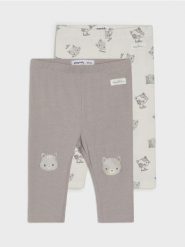 Bawełniane legginsy z motywem kotów - kremowy. Białe legginsy damskie Sinsay, l, bez wzorów, z bawełny. W wyprzedaży za 15.99 zł.