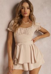 Jasnobeżowy Kombinezon Astinca. Brązowe sukienki damskie Renee, bez wzorów, z tkaniny, eleganckie, bez ramiączek. W wyprzedaży za 111.99 zł.