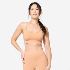Stanik sportowy Decathlon. Białe koszulki sportowe damskie STAREVER, xl, bez wzorów, z elastanu, bez ramiączek, na jogę i pilates. Za 59.99 zł.