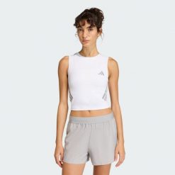 Koszulka adi365 Iconic Running Crop Tank. Białe koszulki damskie Adidas, bez wzorów, bez kołnierzyka, bez ramiączek. Za 129.00 zł.