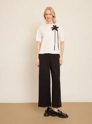 BGN Koszulka w kolorze kremowym rozmiar: 34. Brązowe bluzki damskie BGN, z aplikacjami, bez kołnierzyka, bez ramiączek. Za 56.99 zł.