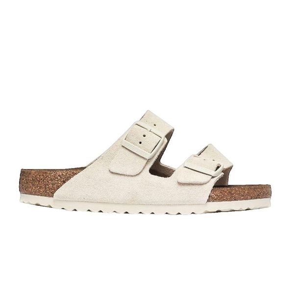Sandały Birkenstock Arizona Antique White. Białe sandały damskie Birkenstock, bez wzorów, ze skóry, bez obcasa, bez zapięcia. Za 551.35 zł.