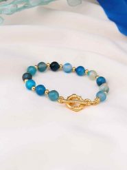 Pierres de Jade Pozłacana bransoletka z elementami ozdobnymi rozmiar: onesize. Niebieskie bransoletki damskie Pierres de Jade, pozłacane. Za 43.99 zł.