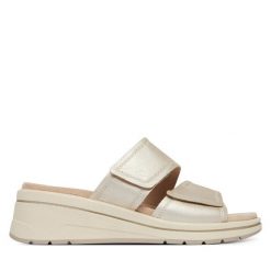 Klapki Caprice. Żółte klapki damskie Caprice, bez wzorów, bez obcasa, bez zapięcia. Za 299.99 zł.