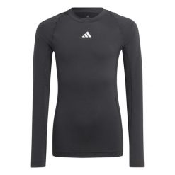 Koszulka adidas Tech Fit Jr. Czarna, dopasowana, z długim rękawem. Czarne koszulki damskie Adidas, bez wzorów, z elastanu, bez kołnierzyka, bez ramiączek. Za 81.00 zł.