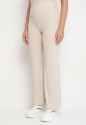 Beżowe Legginsy Dzwony z Wysokim Stanem i Szeroką Gumką w Talii Idoreia. Brązowe legginsy damskie Born2be, m, bez wzorów, z jeansu. Za 49.99 zł.