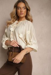Beżowa Wiskozowa Koszula Zdobiona Wiązaniem i Aplikacjami z Kwiatami Belinea. Brązowe koszule damskie Renee, z aplikacjami, z jeansu, eleganckie, bez kołnierzyka, bez ramiączek. Za 59.99 zł.