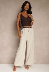 Jasnobeżowe Spodnie o Szerokim Kroju High Waist Dolarenna. Brązowe spodnie materiałowe damskie Renee, bez wzorów, z jeansu. Za 119.99 zł.