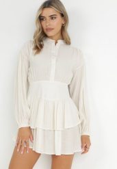 Beżowa Sukienka Mini z Falbaną i Guzikami Othia. Brązowe sukienki damskie Born2be, bez wzorów, z materiału, bez ramiączek. Za 189.99 zł.