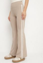 Beżowe Marszczone Legginsy Dzwony z Wysokim Stanem i Lampasami Nakatia. Brązowe legginsy damskie Born2be, l, bez wzorów, z jeansu. Za 49.99 zł.