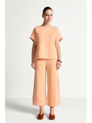 Rich & Royal Spodnie w kolorze pomarańczowym rozmiar: S. Pomarańczowe spodnie materiałowe damskie Rich & Royal, bez wzorów, z materiału. Za 229.95 zł.