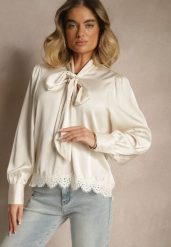 Beżowa Bluzka Wiązana Przy Dekolcie z Ażurową Koronką na Dole Haliritia. Brązowe bluzki damskie Renee, l, w ażurowe wzory, z jeansu, eleganckie, bez kołnierzyka, bez ramiączek. Za 59.99 zł.