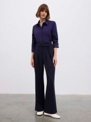 BGN Spodnie w kolorze granatowym rozmiar: 36. Niebieskie spodnie materiałowe damskie BGN, bez wzorów, z materiału. Za 156.61 zł.