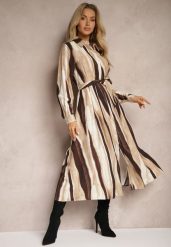 Brązowa Koszulowa Sukienka w Abstrakcyjne Paski o Długim Kroju z Gumką i Paskiem w Talii Nerithal. Brązowe sukienki damskie Renee, bez wzorów, eleganckie, bez ramiączek. W wyprzedaży za 111.99 zł.
