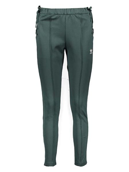Adidas Spodnie dresowe w kolorze zielonym rozmiar: 34. Zielone spodnie dresowe damskie Adidas, bez wzorów, z dresówki. Za 122.67 zł.