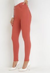 Pomarańczowe Spodnie Skinny z Wysokim Stanem Ninga. Brązowe rurki damskie Born2be, bez wzorów, z jeansu, z podwyższonym stanem. Za 34.99 zł.