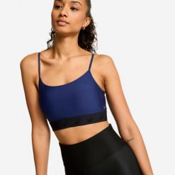 Stanik sportowy. Niebieskie biustonosze sportowe damskie Decathlon, bez wzorów, z elastanu. Za 52.49 zł.