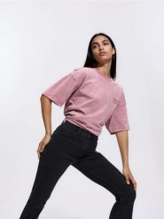 Jeansy flare z krótszą nogawką - czarny. Czarne jeansy damskie Reserved. Za 129.99 zł.