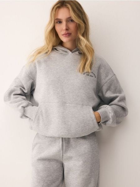 Bluza oversize z kapturem - jasnoszary. Szare bluzy damskie Reserved, l, bez wzorów, z bawełny, z kapturem. Za 119.99 zł.